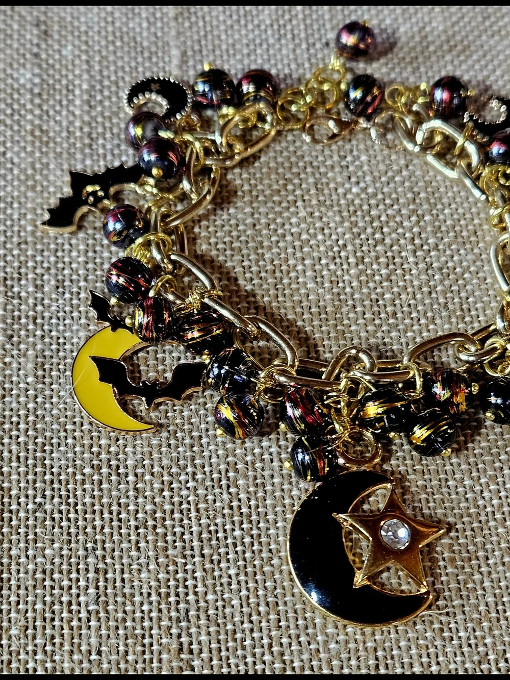 Gold-Tone Moon, Stars And Black Bats Charm Bracelet in Black and Yellow - Picture 3 of 8